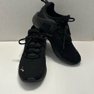 Puma black and gold cross trainer